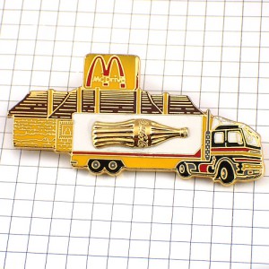 ピンバッジ・マクドナルドＭコカコーラ金色壜の絵のトラック車