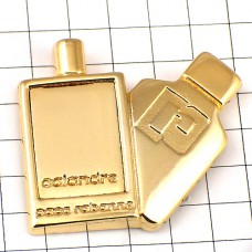 ピンバッジ・香水パコラバンヌ壜ゴールド金色 CALANDRE PACO-RABANNE