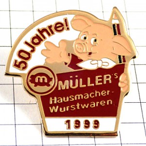 ピンバッジ・ピンク色のブタ豚と鉛筆50周年ドイツ語 MULLER CHARCUTIER WURSTWAREN GERMANY