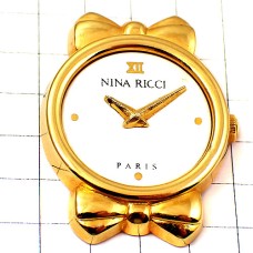 ピンバッジ・ニナリッチ腕時計リボン金色ゴールド NINA-RICCI