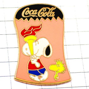 ピンバッジ・聖火リレーするスヌーピー漫画コカコーラ鳥ウッドストック WOODSTOCK SNOOPY