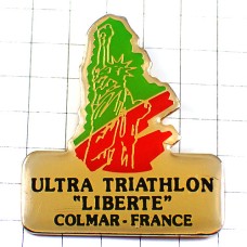 ピンバッジ・自由の女神ウルトラトライアスロン競技 BARTHOLDI STATUE-OF-LIBERTY NEW-YORK USA COLMAR TRIATHLON FRANCE