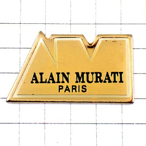 ピンバッジ・アランムラティ洋服ＡＭ金色ゴールド文字