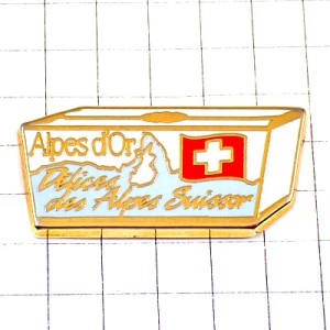 ピンバッジ・チョコレートの箱スイス国旗アルプス山脈