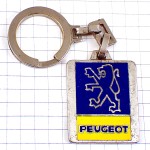 キーホルダー・紺色のライオン車プジョーエンブレム黄色ロゴ