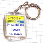 キーホルダー・白いシャツのタヌキ狸 FRIGIDAIRE