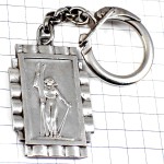 キーホルダー・サヴォワ県十字の紋章スキーヤー女の子シルバー銀色