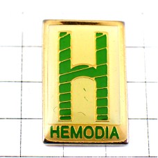 ピンバッジ・アルファベットＨ緑の文字 HEMODIA H-LETTER