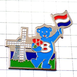 ピンバッジ・風車小屋と青い熊の観光ガイド国旗オランダ赤い花チューリップ BUTAGAZ NETHERLAND FLAG