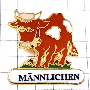 ピンバッジ・メンリヘンの茶色いウシ牛スイス山アルプス