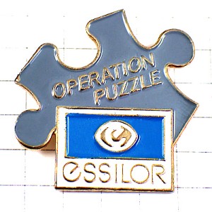 ピンバッジ・パズルのピース眼鏡エシロール社メガネ ESSILOR PUZZLE FRANCE